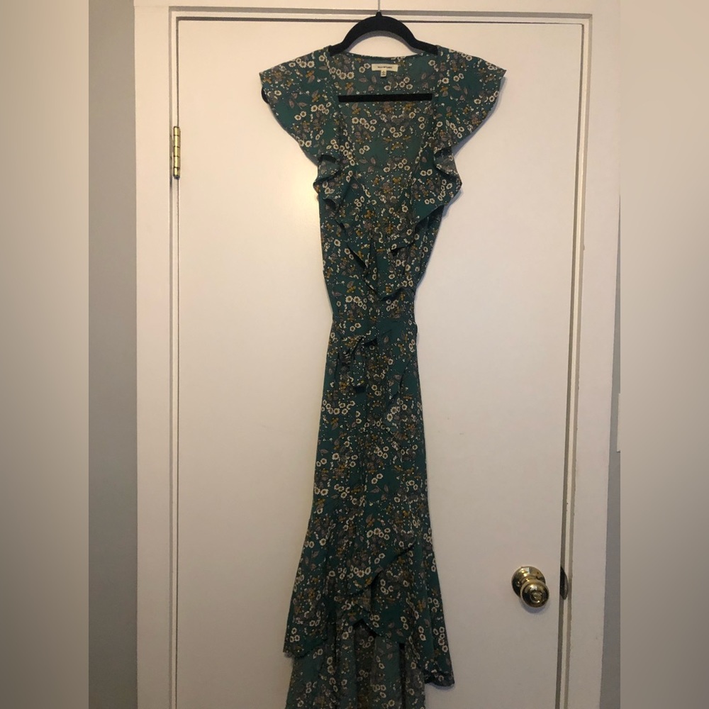 Women’s floral green wrap dress. Short sleeved. High low. Ruffle detail.